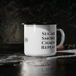 Knight's Campfire Mug on dark slate, showing the Sugar Smoke Chaos Repeat print and The Chimney Cake badge