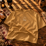 Mustard gold tee laid flat, I got that dog in me printed small above a dachshund chimney cake