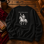 Back of the black sweatshirt: a knight on horseback raising a chimney cake beneath the words Bake it till you make it.