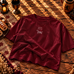 Cardinal red kids’ tee laid flat, I got that dog in me printed small above a dachshund chimney cake