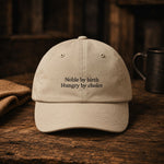 The same cap in Stone, with the Noble by birth, Hungry by choice embroidery in dark thread